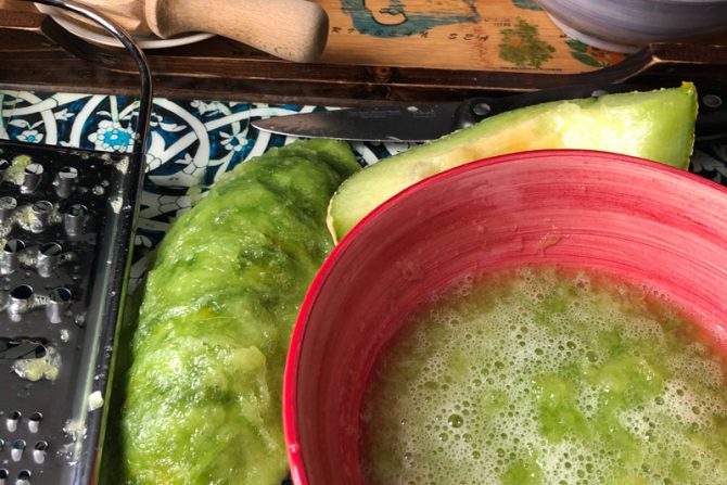 Green melon slushy with grater - messy food prep shot