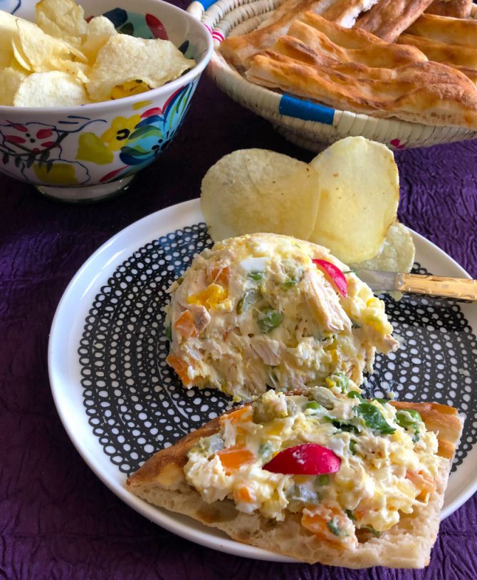Salad Olivier (سالاد الیویه) aka Russian Salad with potato chips and basket of Barbari Persian bread