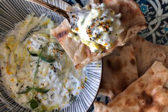 Zucchini yogurt borani (kadoo mast in Persian) served with Sangak bread for Persian food blog recipe post