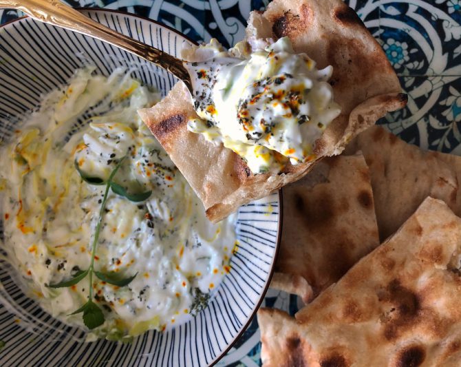 Zucchini yogurt borani (kadoo mast in Persian) served with Sangak bread for Persian food blog recipe post